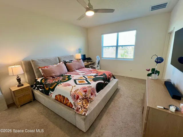 a view of a dining room with furniture and window