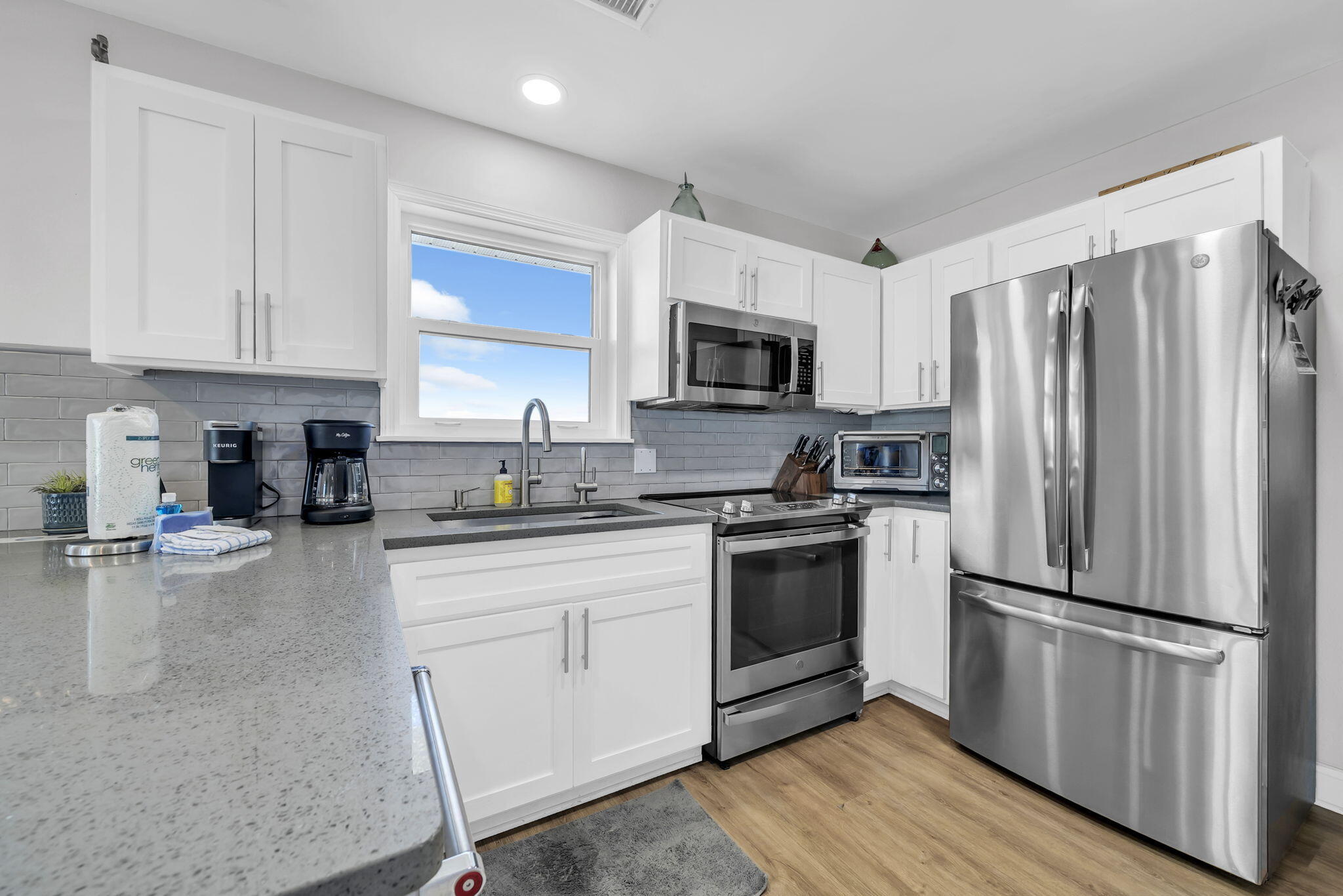 11 Beachside Drive, Unit 131 Santa Rosa Beach, FL 32459 - Photo 8 of 25 a kitchen with a refrigerator stove and sink
