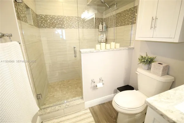 a view of balcony with wooden floor