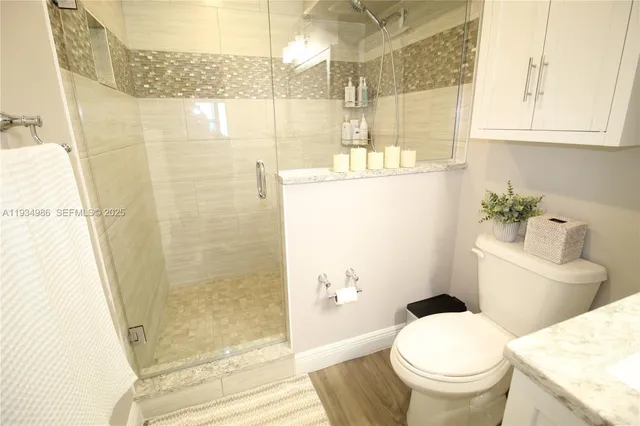 a view of balcony with wooden floor