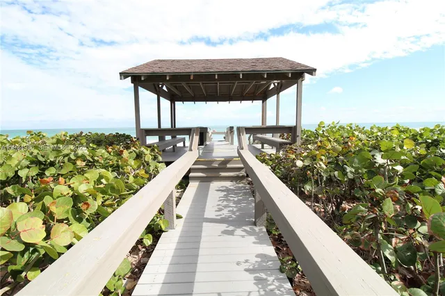 a view of a floor to ceiling window and a yard