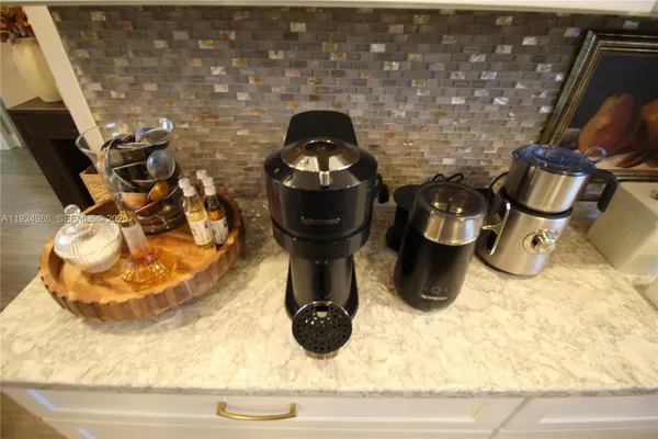 a kitchen with a sink stove and microwave