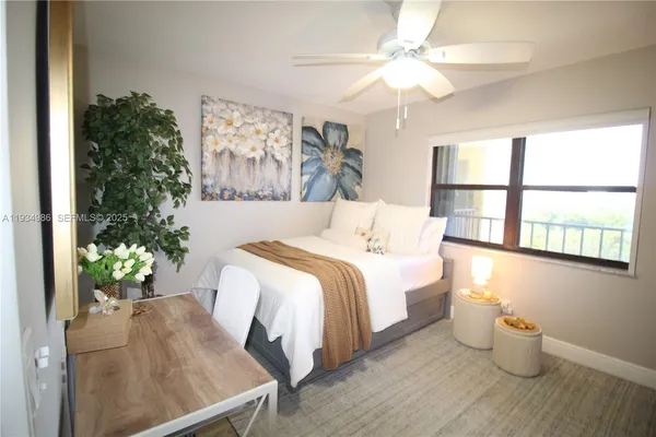 a bathroom with a granite countertop sink toilet and a mirror