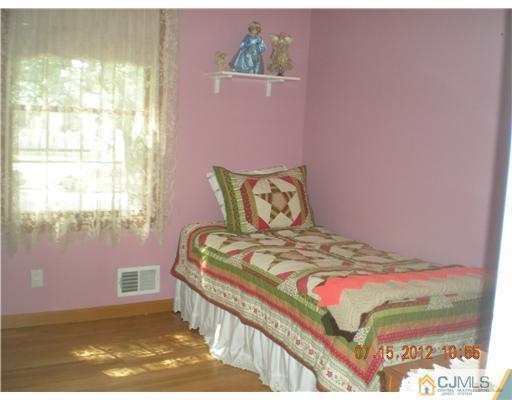 15 Harvard Road Old Bridge, NJ 08859 - Photo 12 of 20 a bedroom with a bed and a window