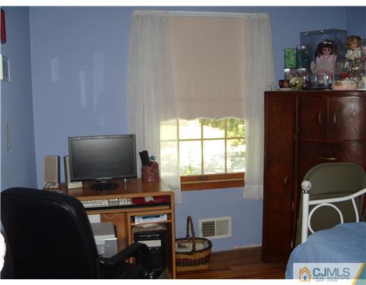 15 Harvard Road Old Bridge, NJ 08859 - Photo 14 of 20 a living room with furniture and a flat screen tv