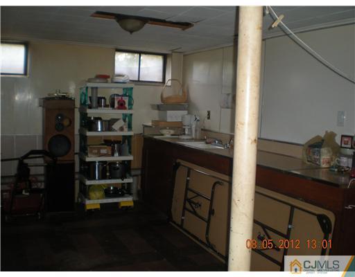 15 Harvard Road Old Bridge, NJ 08859 - Photo 16 of 20 a kitchen with refrigerator and cabinets