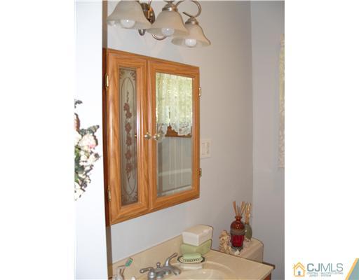 15 Harvard Road Old Bridge, NJ 08859 - Photo 5 of 20 a bathroom with a sink and a mirror