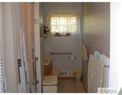 15 Harvard Road Old Bridge, NJ 08859 - Photo 6 of 20 a bathroom with a window and a shower