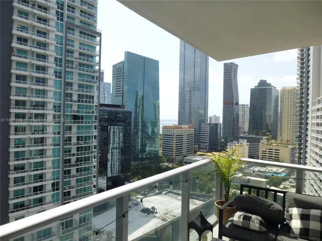 a view of balcony with a couple of chairs
