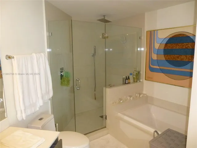 a bathroom with a shower and bathtub