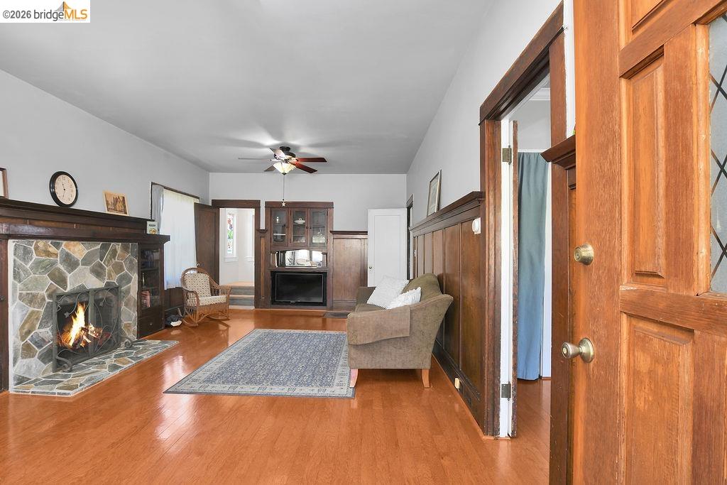 325 South 2nd Street Rio Vista, CA 94571 - Photo 29 of 33 Inviting living space featuring wood-finish flooring and a stone-clad fireplace