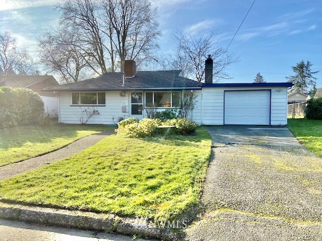 859 Queen Avenue Northeast Renton, WA 98056 - Photo 1 of 24 a front view of a house with a yard