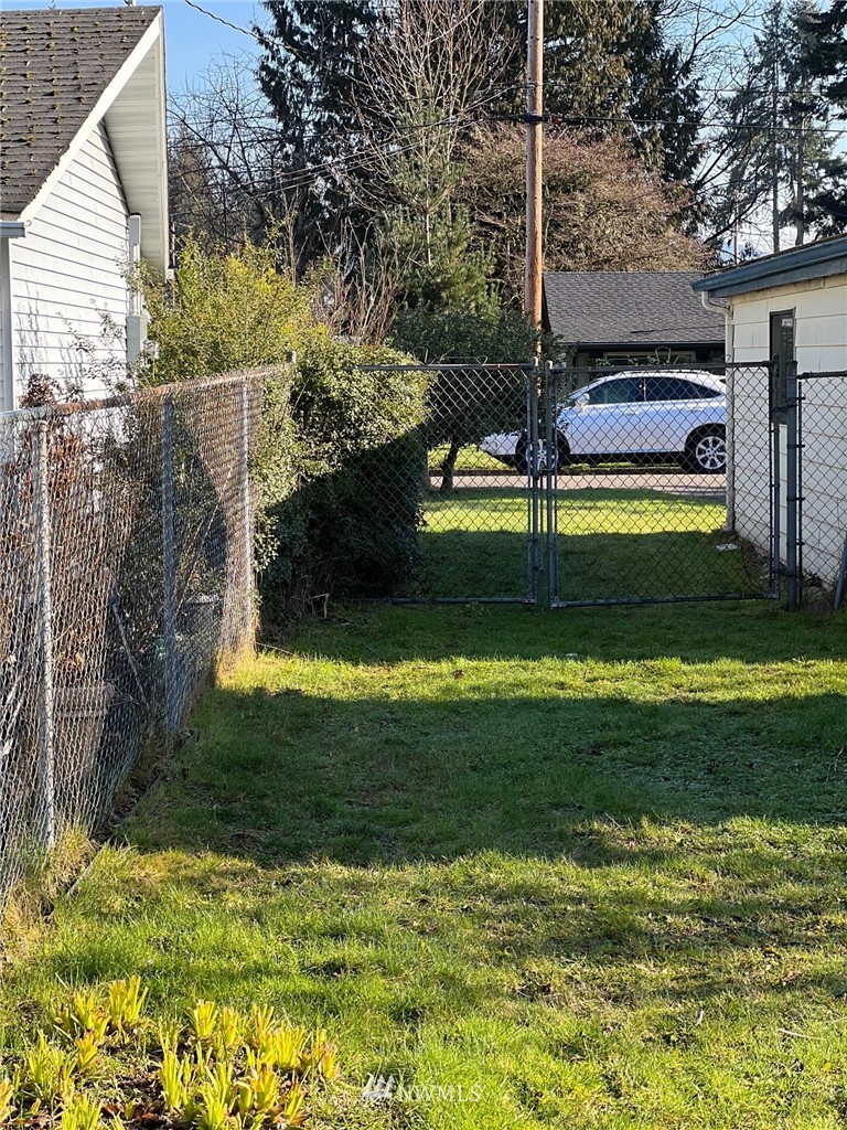 859 Queen Avenue Northeast Renton, WA 98056 - Photo 24 of 24 a view of a house with a yard