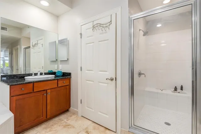 a bedroom with a large bed and a large window