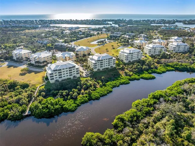 an aerial view of lake and city