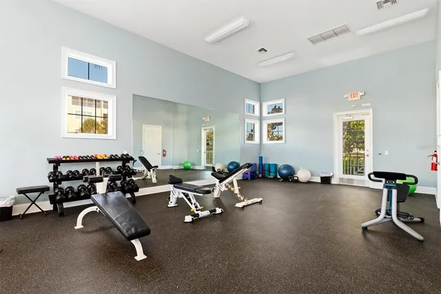an aerial view of residential houses with outdoor space and lake view