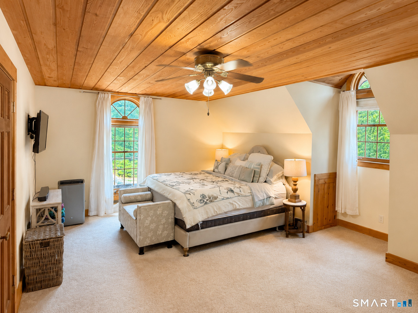 44 Pine Road Colebrook, CT 06021 - Photo 28 of 40 a spacious bedroom with a bed and a chandelier