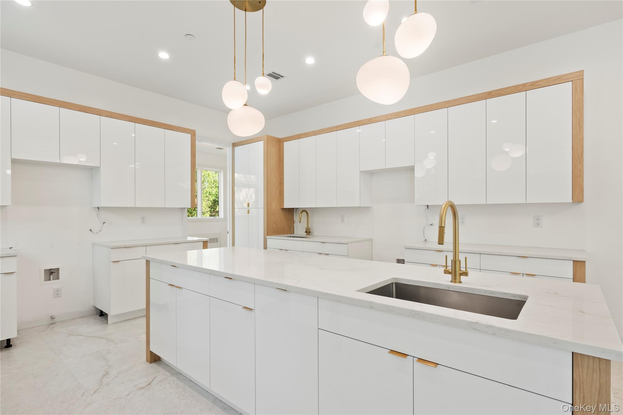 130 Union Road, Unit 201 Spring Valley, NY 10977 - Photo 11 of 47 a kitchen with a sink dishwasher and white cabinets with wooden floor