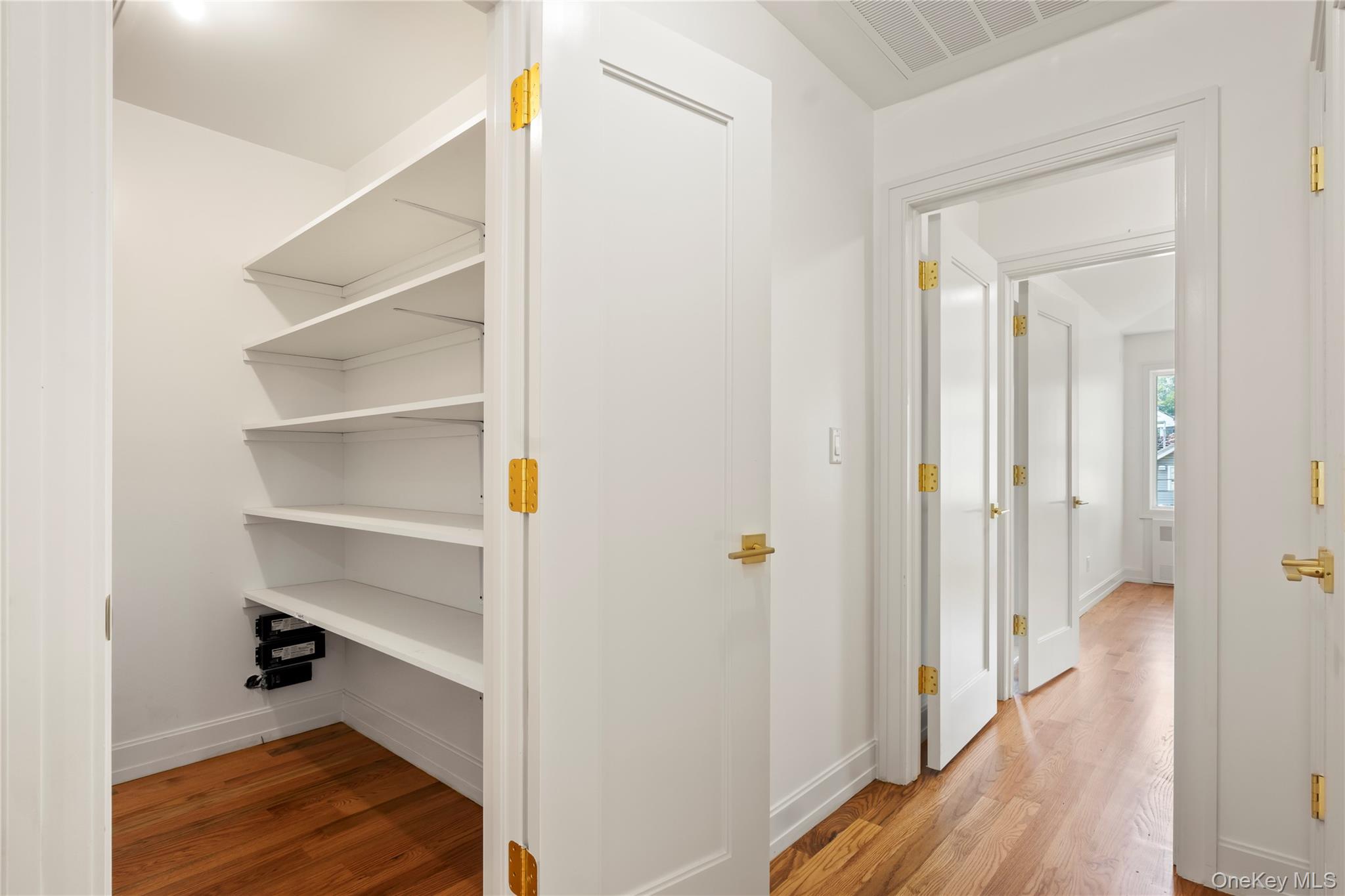 130 Union Road, Unit 201 Spring Valley, NY 10977 - Photo 18 of 47 a view of a hallway with wooden floor and closet