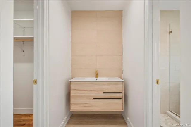 a white bath tub sitting next to a white toilet