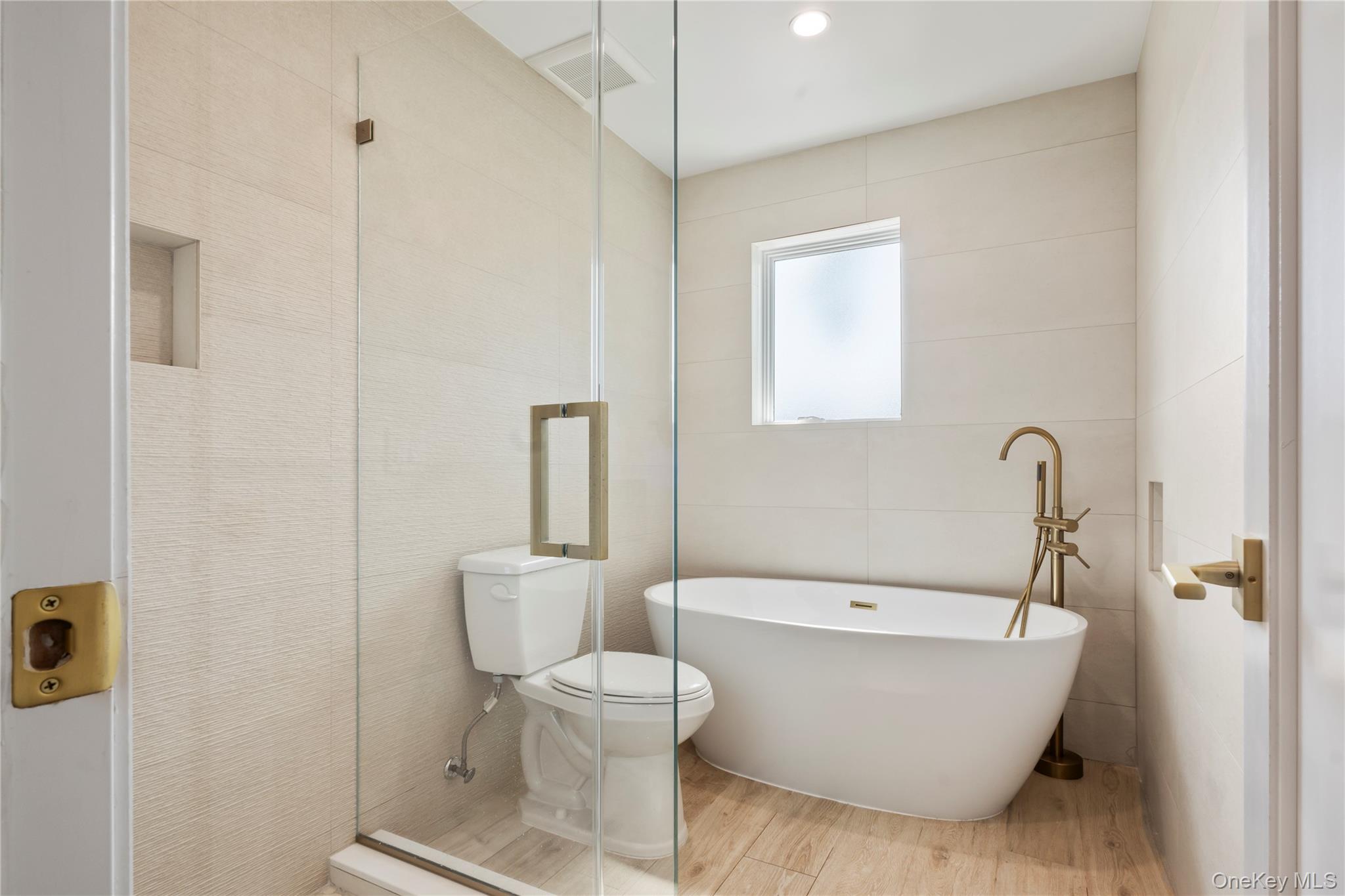 130 Union Road, Unit 201 Spring Valley, NY 10977 - Photo 24 of 47 a white bath tub sitting next to a white toilet