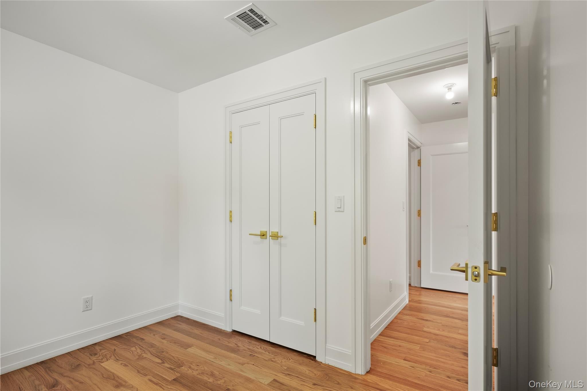 130 Union Road, Unit 201 Spring Valley, NY 10977 - Photo 27 of 47 a view of a hallway with wooden floor