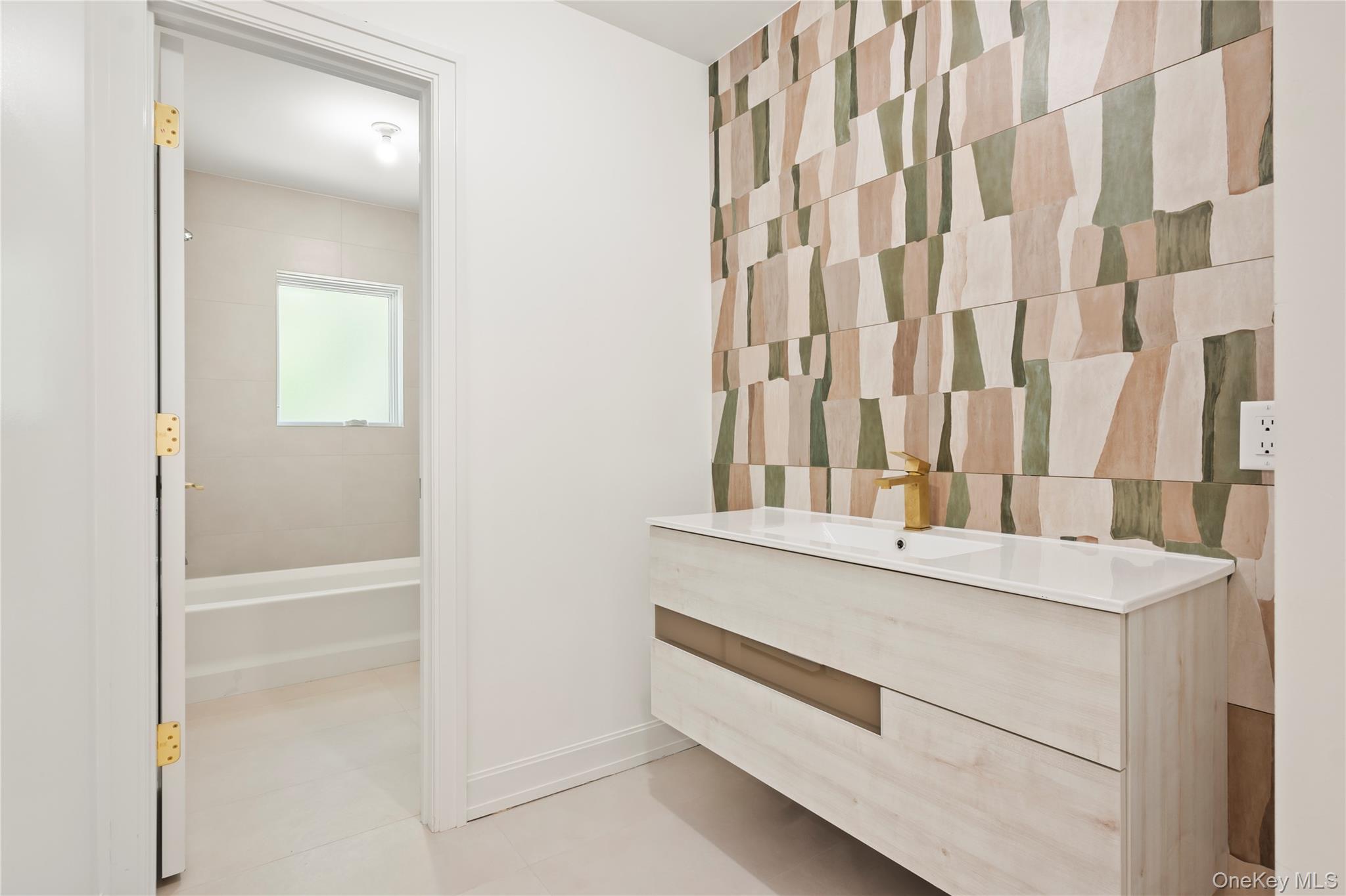 130 Union Road, Unit 201 Spring Valley, NY 10977 - Photo 28 of 47 a bathroom with a sink and a mirror