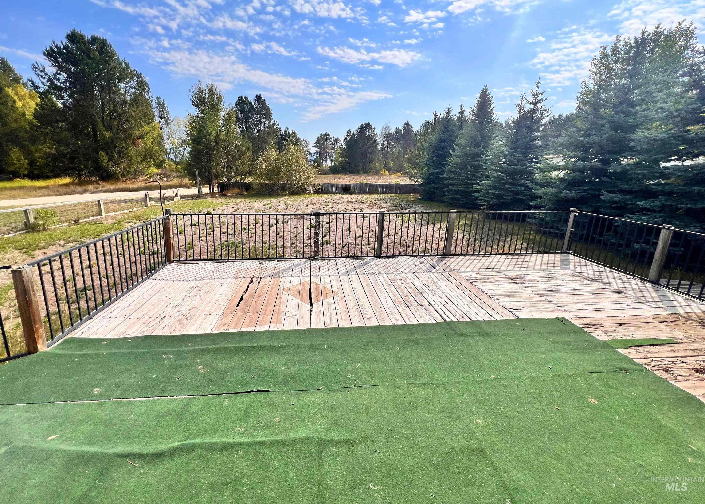 955 South Main Street, Unit 30 Cascade, ID 83611 - Photo 3 of 19 Wooden deck with a yard