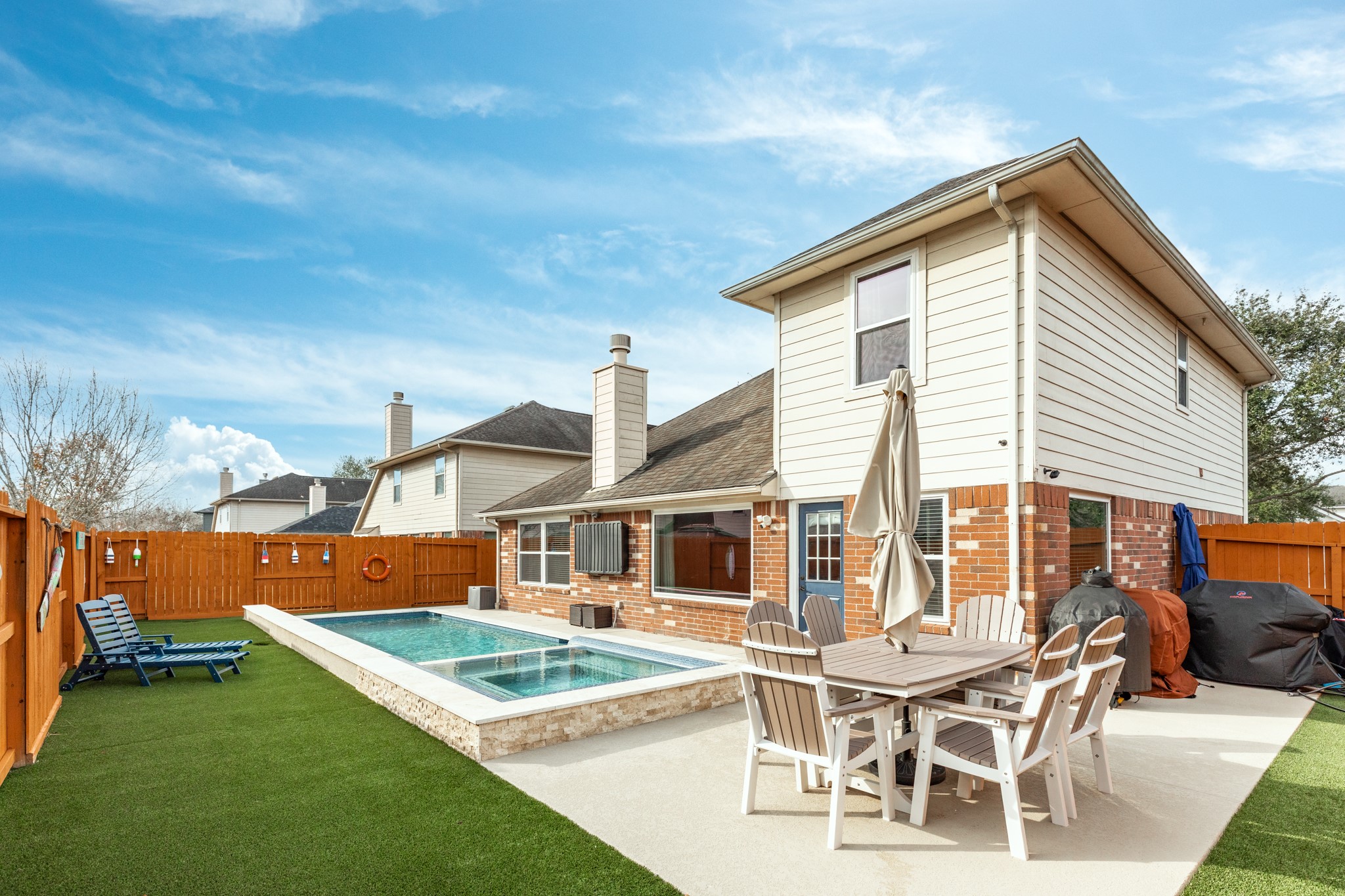 4113 Merlet Drive Pearland, TX 77584 - Photo 30 of 36 The patio area was added at the same time the pool was installed and is perfect for entertaining.