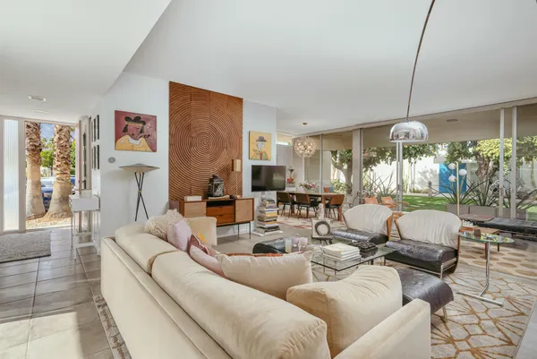 a deck of a house with lots of green space