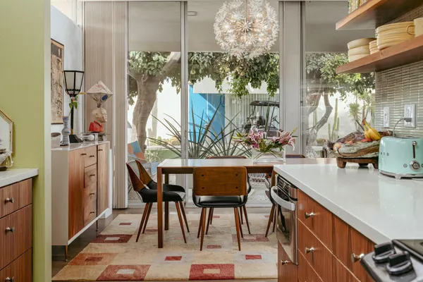 a view of a porch with potted plants