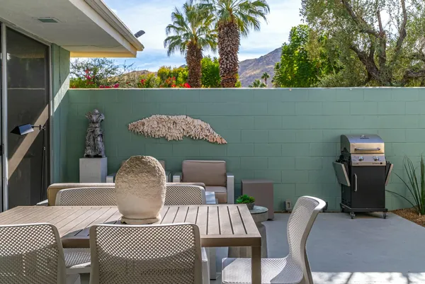 a view of swimming pool with outdoor seating