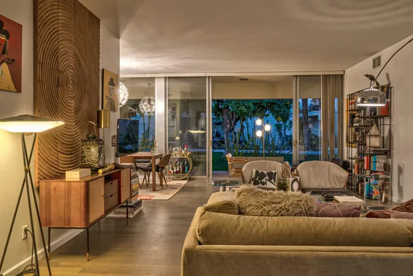 a living room with furniture and a large window