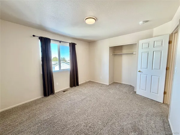 a view of a livingroom with a staircase
