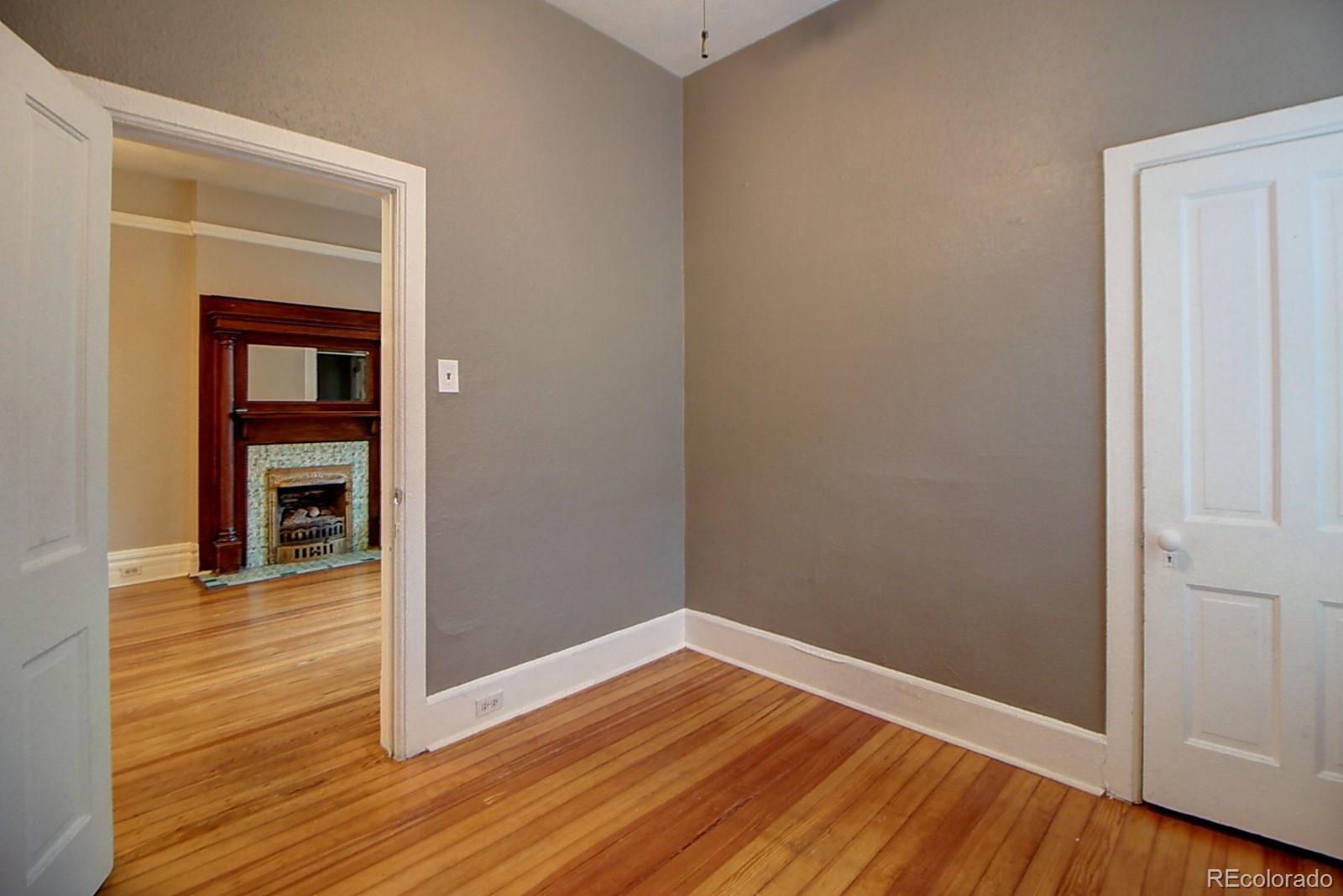 328 Inca Street Denver, CO 80223 - Photo 11 of 35 wooden floor in an empty room