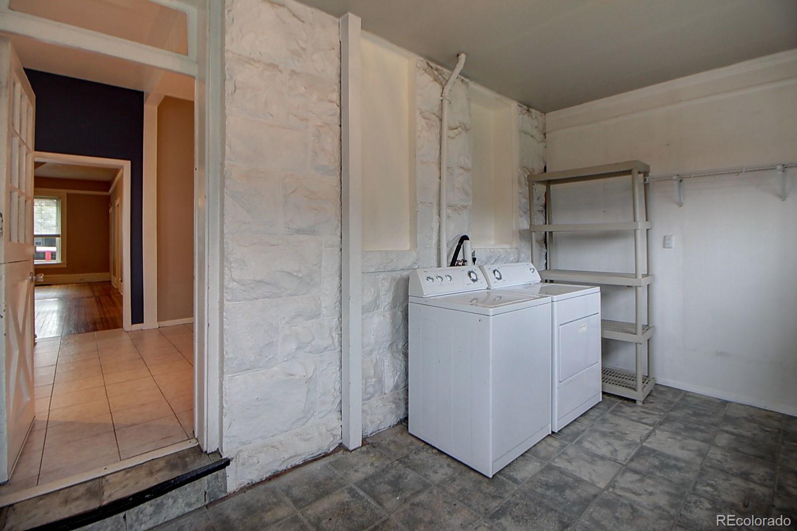 328 Inca Street Denver, CO 80223 - Photo 24 of 35 a utility room with a sink washer and dryer