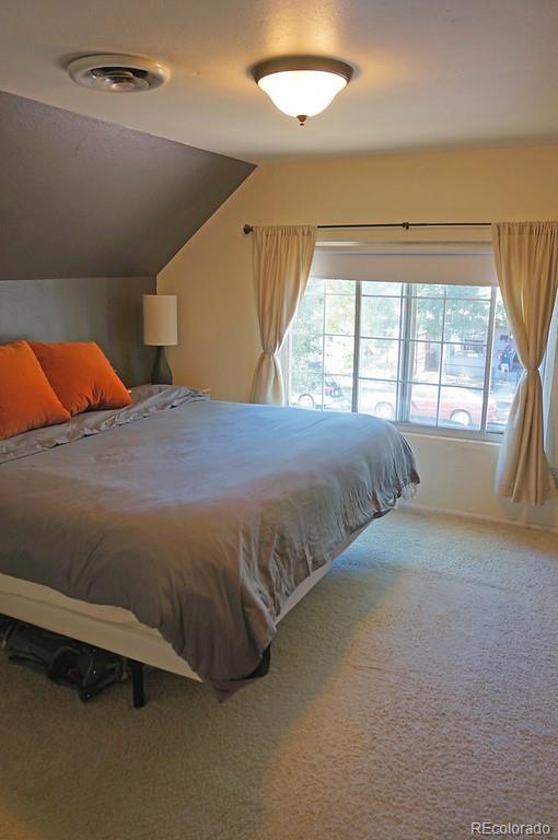 328 Inca Street Denver, CO 80223 - Photo 25 of 35 a bedroom with a bed and a window