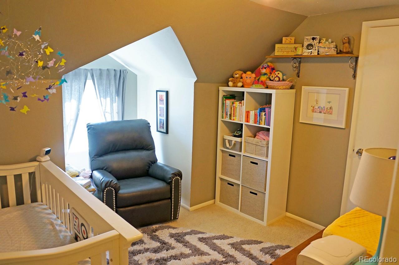 328 Inca Street Denver, CO 80223 - Photo 28 of 35 a living room with furniture and a window