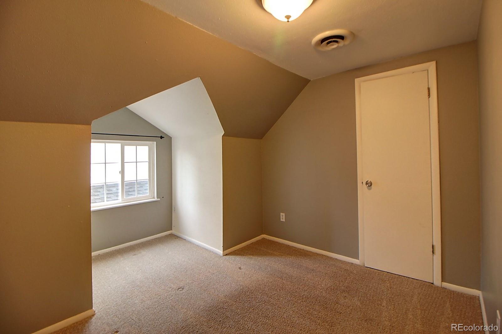 328 Inca Street Denver, CO 80223 - Photo 29 of 35 a view of an empty room with a window