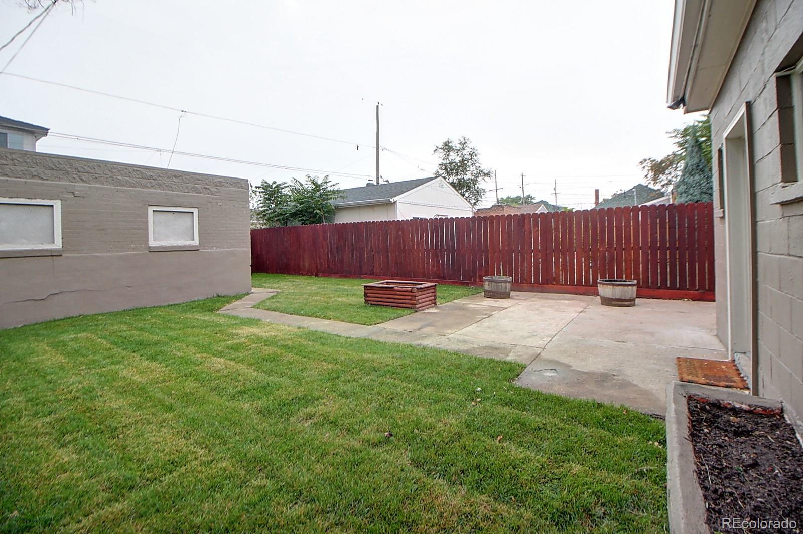 328 Inca Street Denver, CO 80223 - Photo 34 of 35 a view of backyard with a garden and plants