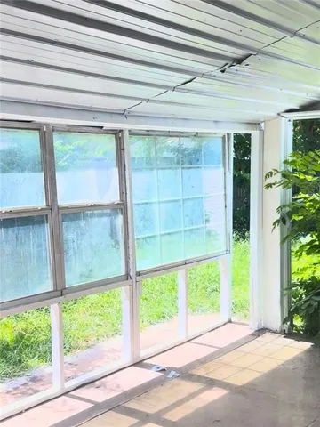 a view of an entryway with a garden