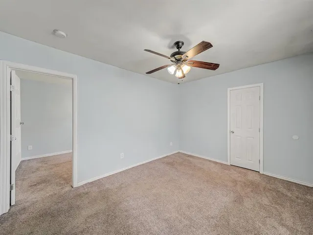 a view of a big room with carpet