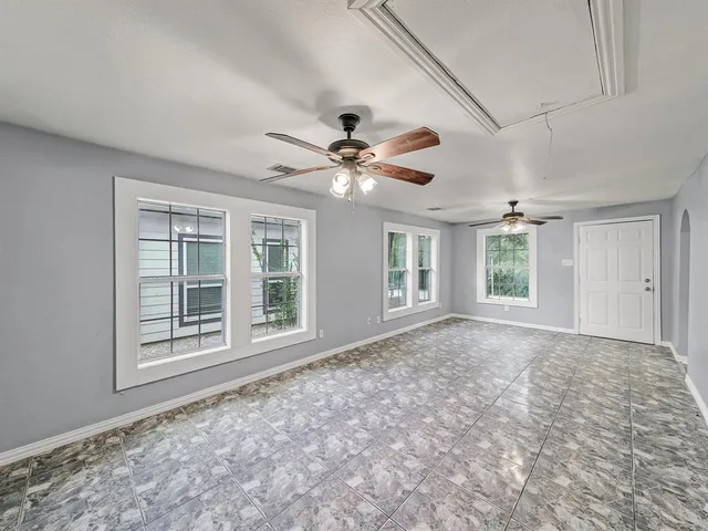 a view of an empty room with a window