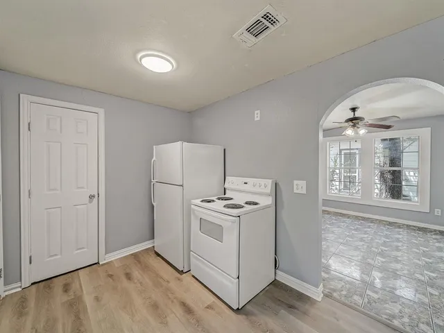 a kitchen that has a stove and a sink