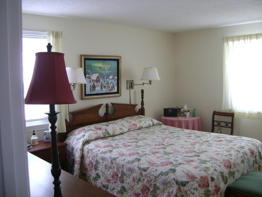 137 Flintlock Village Road, Unit 1 Wells, ME 04090 - Photo 17 of 30 First floor bedroom offers a double...