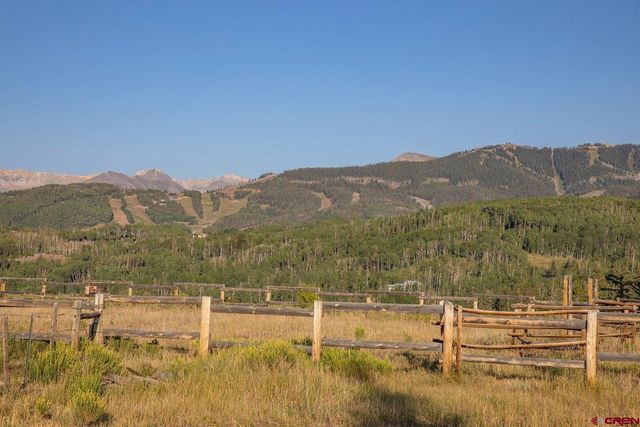 a view of a town with mountains in the background