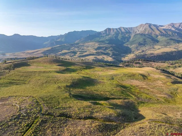 a view of an ocean and a mountain