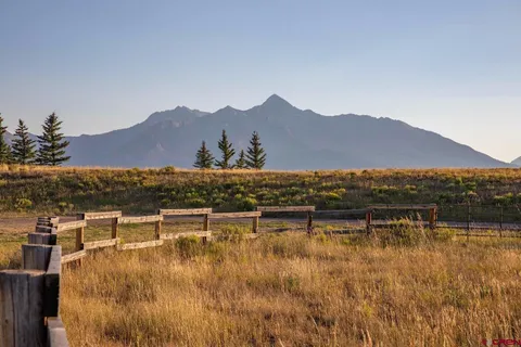 a view of house with lake view and mountain view