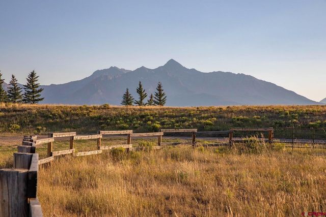 a view of house with lake view and mountain view