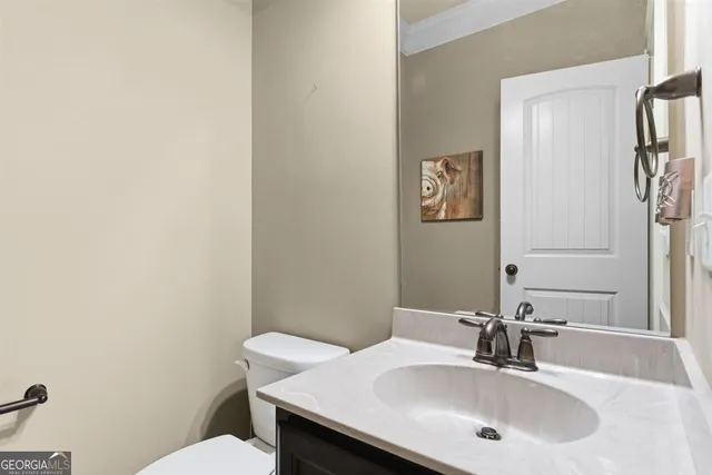 a view of a patio with table and chairs and couches with wooden floor and fence